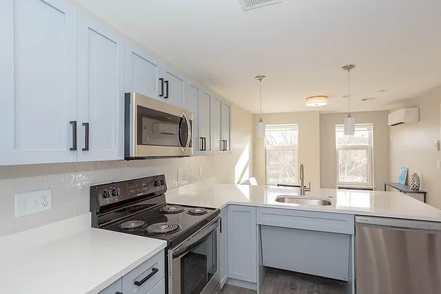 a kitchen with a stove and a sink
