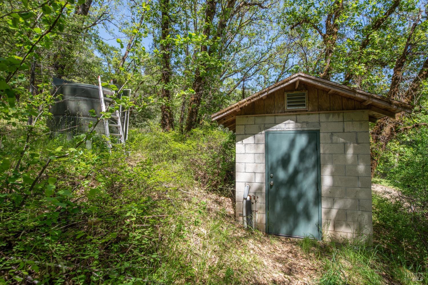 16300-16333 Yerba Santa Road Geyserville, CA 95441 - Photo 17 of 35 a front view of a house with a yard