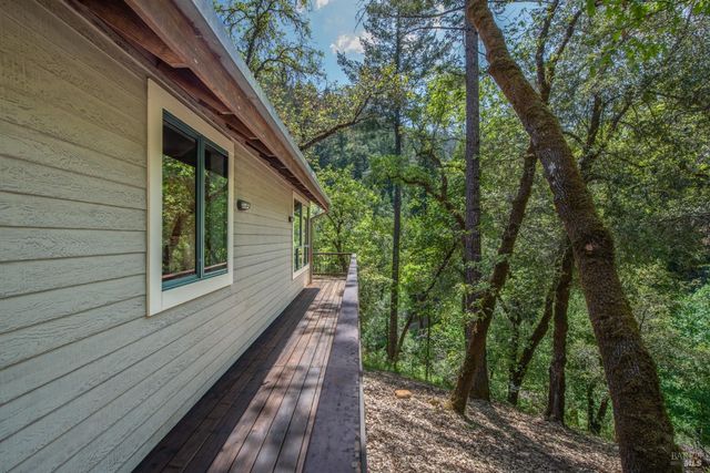 a view of a balcony with trees