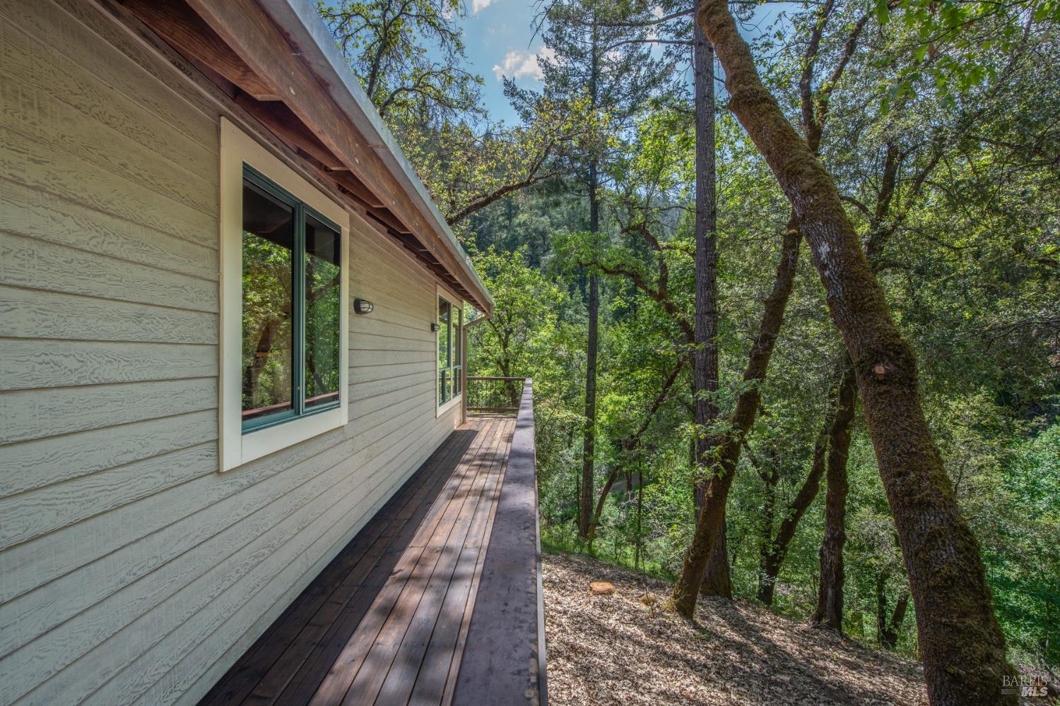 16300-16333 Yerba Santa Road Geyserville, CA 95441 - Photo 18 of 35 a view of a balcony with trees