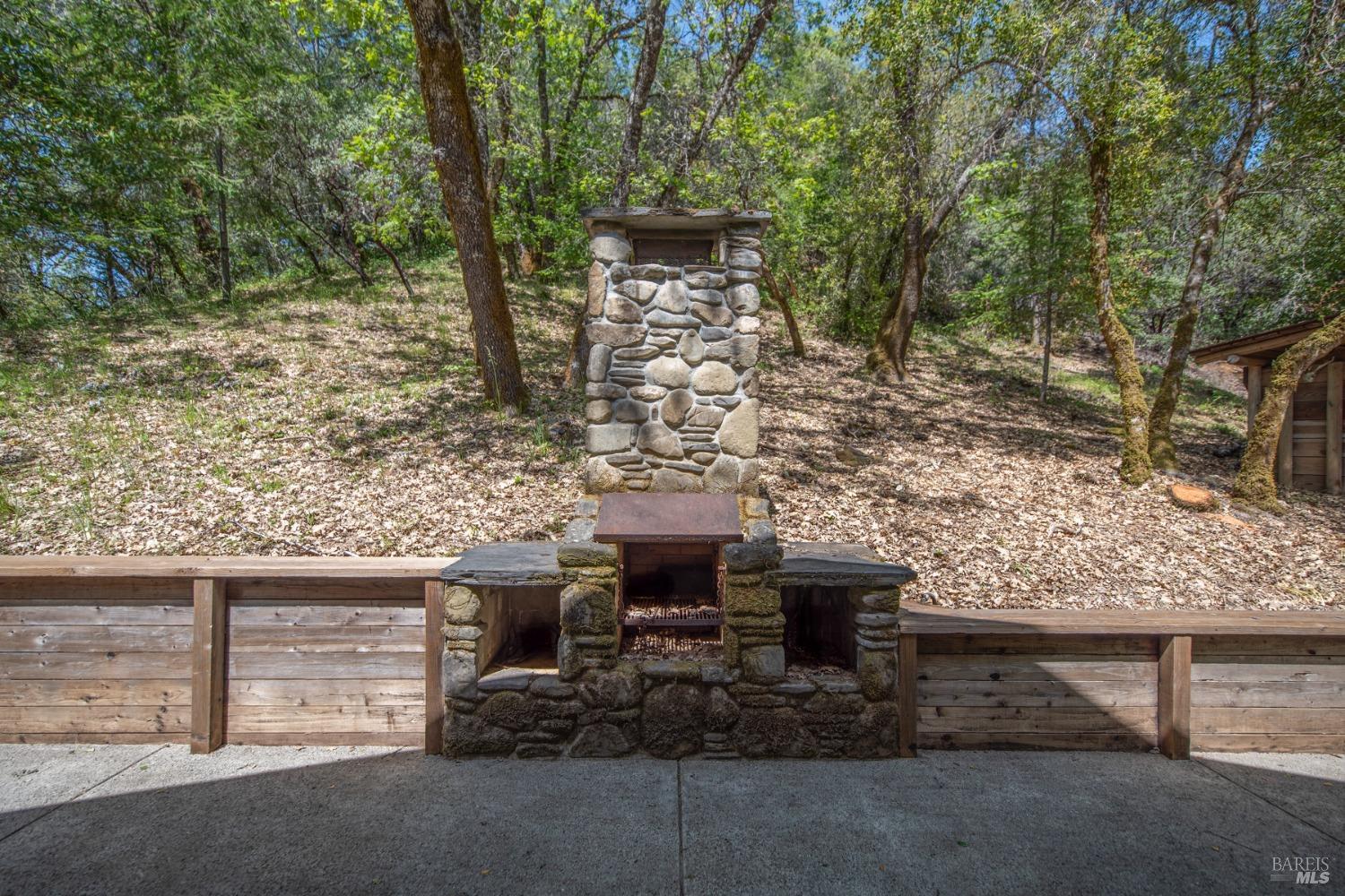 16300-16333 Yerba Santa Road Geyserville, CA 95441 - Photo 20 of 35 a view of a bench in front of building