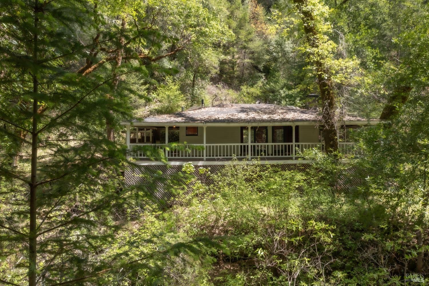 16300-16333 Yerba Santa Road Geyserville, CA 95441 - Photo 22 of 35 a front view of a house with a garden
