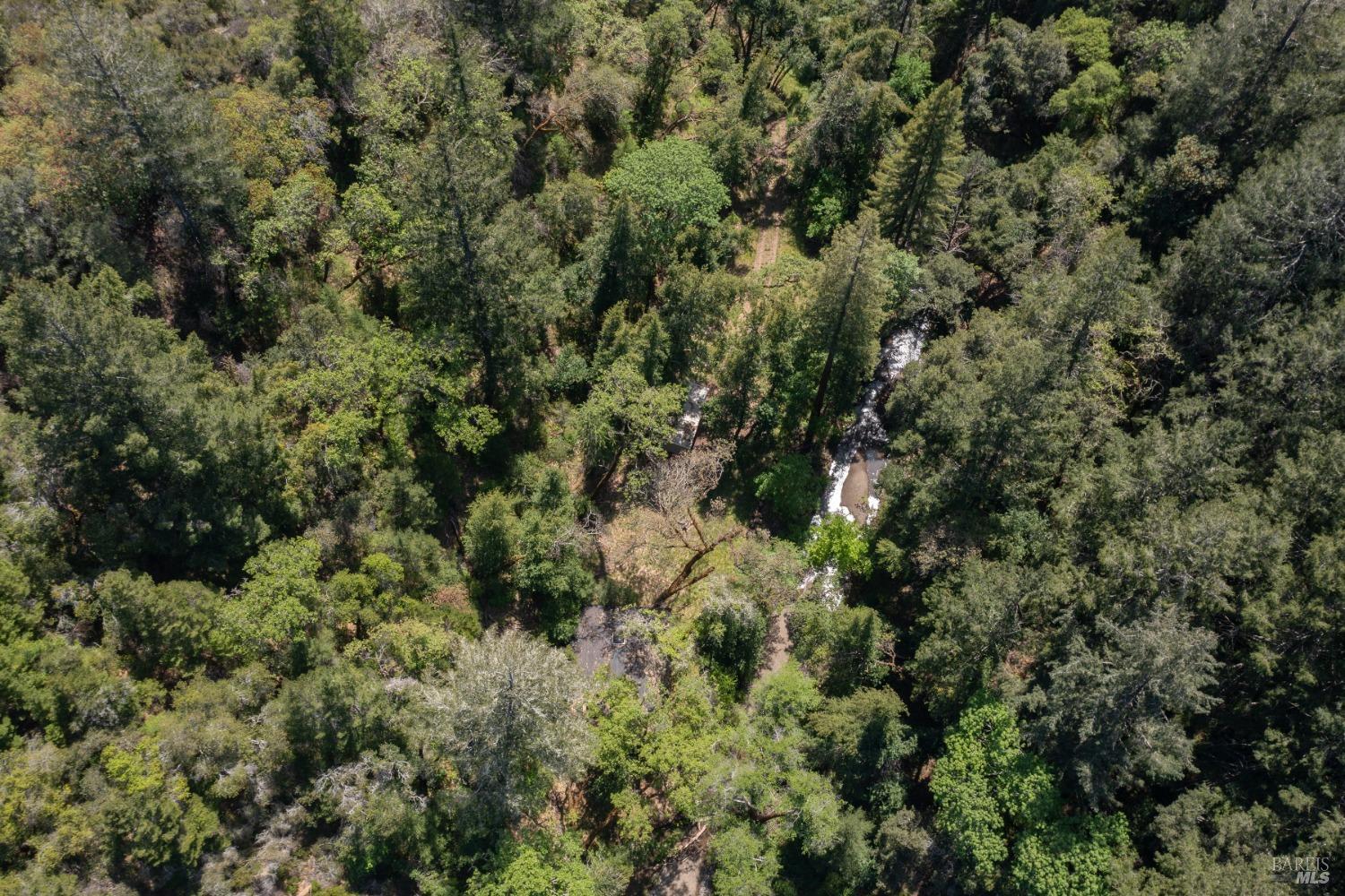 16300-16333 Yerba Santa Road Geyserville, CA 95441 - Photo 23 of 35 an aerial view of residential house with space and trees all around