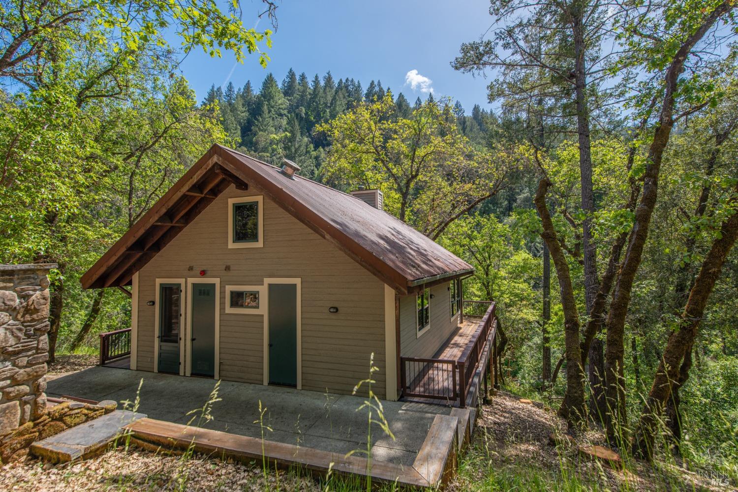 16300-16333 Yerba Santa Road Geyserville, CA 95441 - Photo 3 of 35 a front view of a house with garden