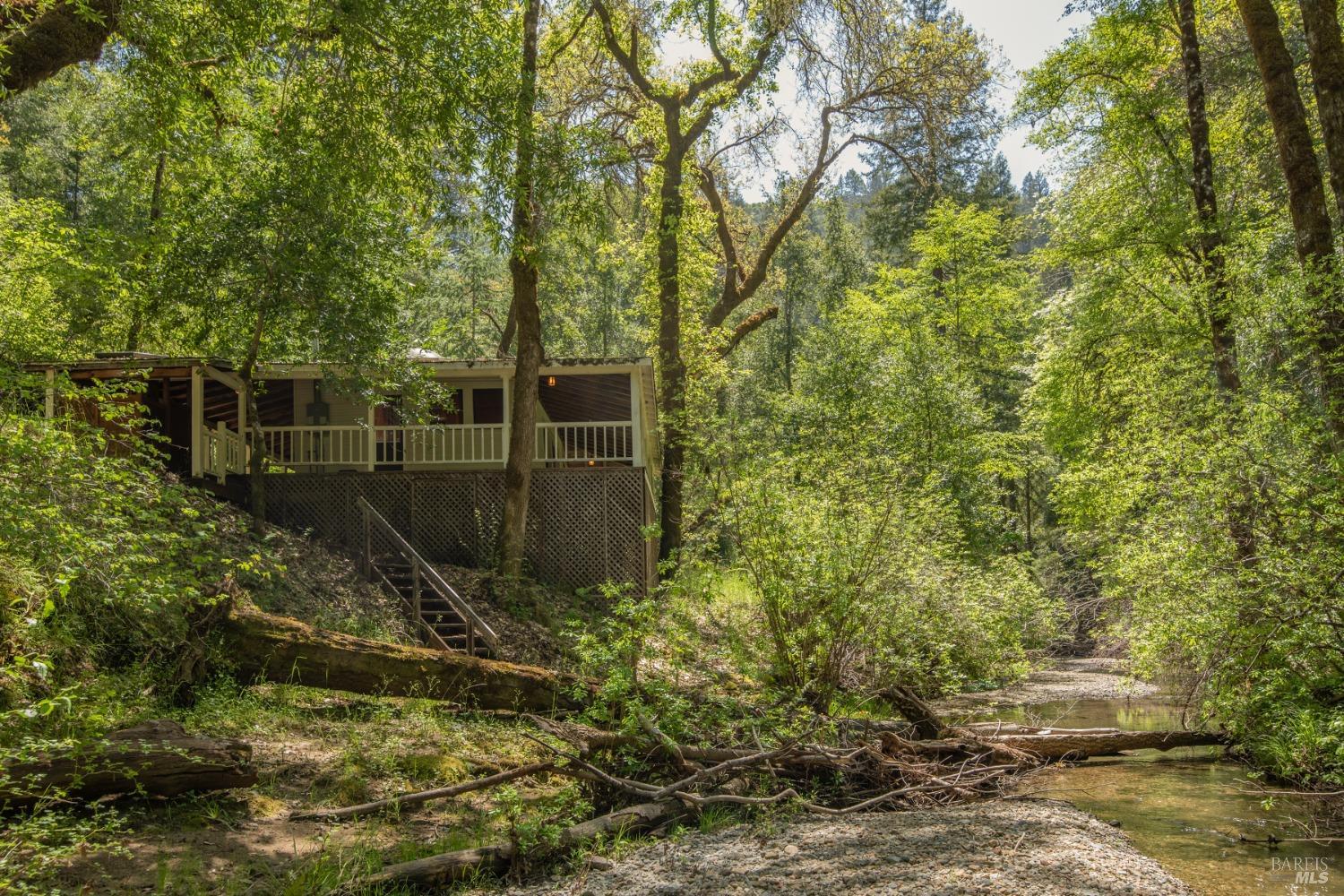 16300-16333 Yerba Santa Road Geyserville, CA 95441 - Photo 31 of 35 a backyard of a house with lots of green space