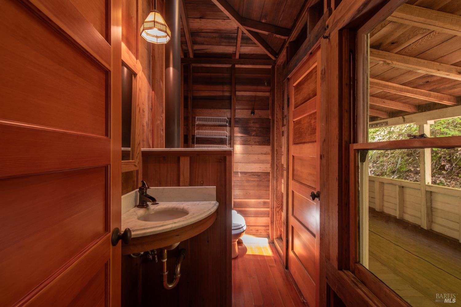 16300-16333 Yerba Santa Road Geyserville, CA 95441 - Photo 32 of 35 a bathroom with a sink and a mirror