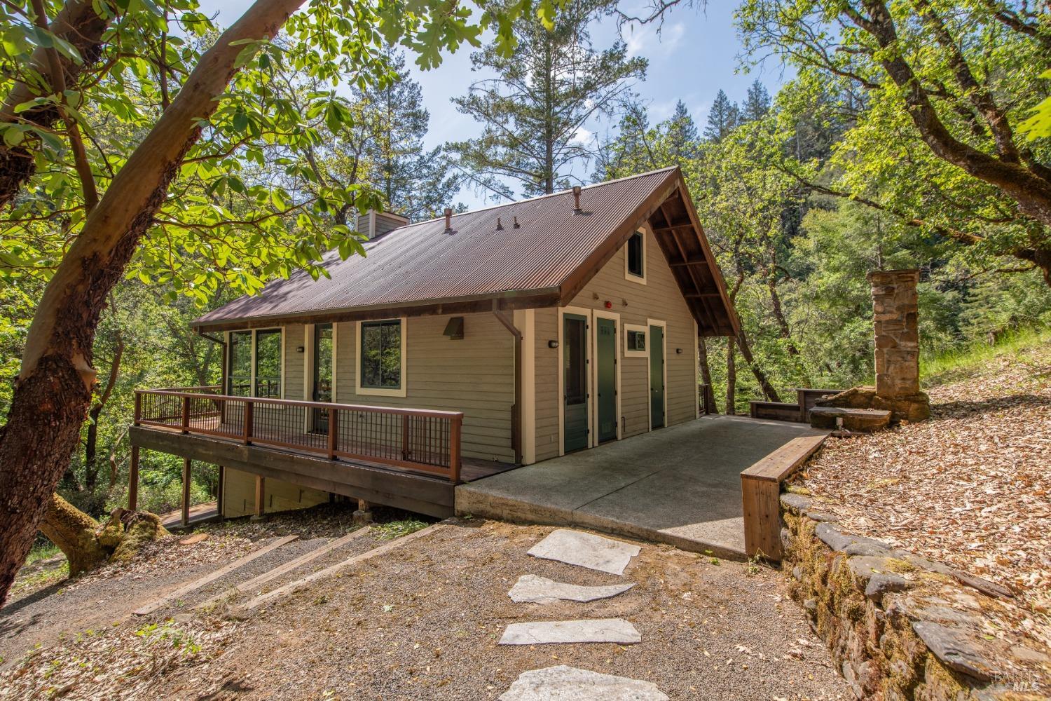 16300-16333 Yerba Santa Road Geyserville, CA 95441 - Photo 5 of 35 a front view of a house with garden