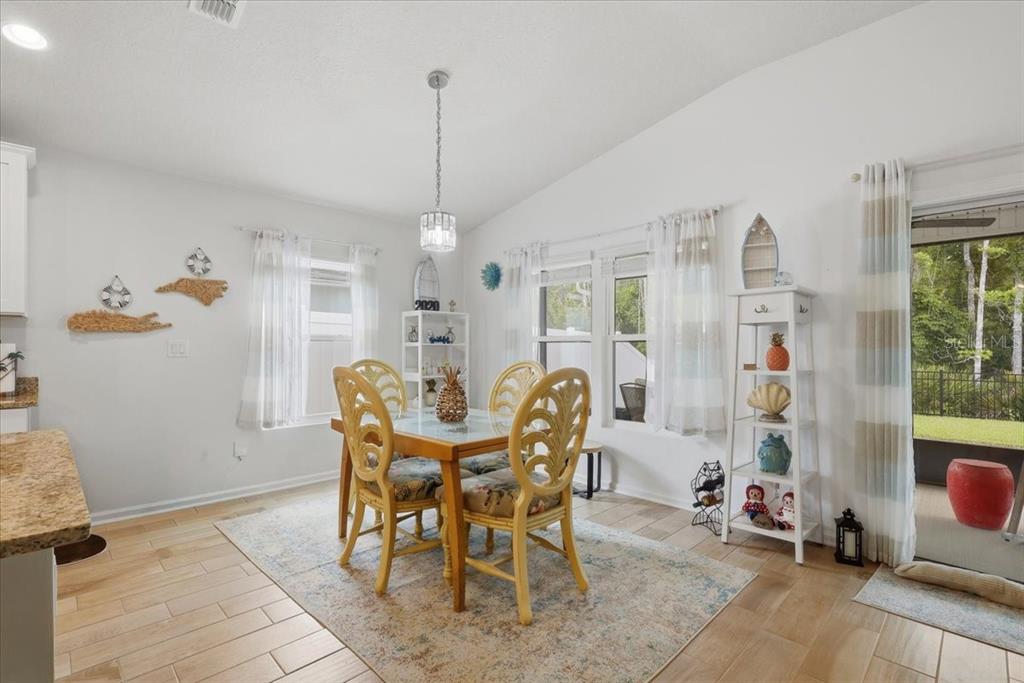 35 Birdie Way Bunnell, FL 32110 - Photo 28 of 57 a view of a dining room with furniture and a chandelier