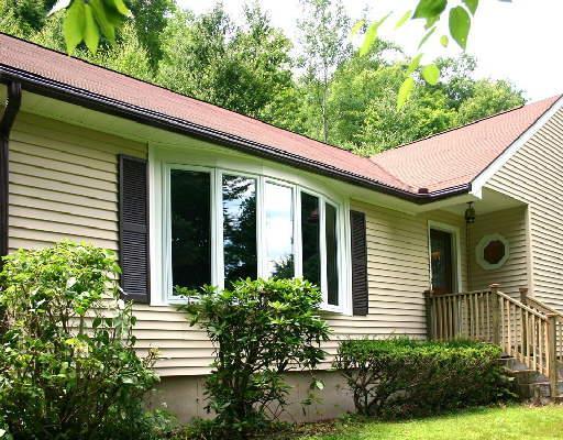100 O'neill Road Oxford, CT 06478 - Photo 1 of 1 a view of a house with potted plants and a table and chairs