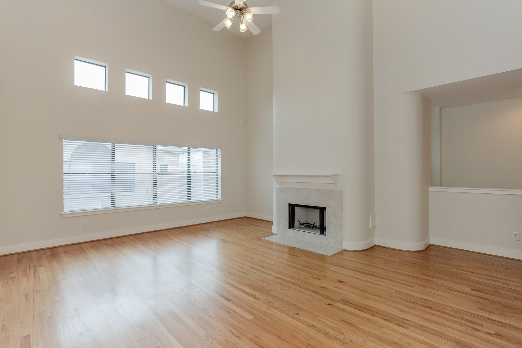 2705 Rutland Street, Unit B Houston, TX 77008 - Photo 9 of 21 Thanks to the two story Living Room, natural light floods this area. Gas Fireplace.