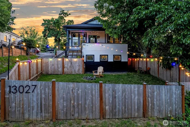 a front view of house with wooden fence
