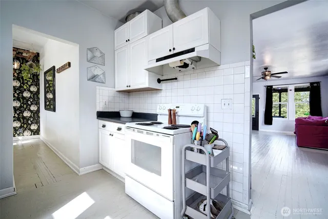 a kitchen with stainless steel appliances granite countertop a stove and a sink