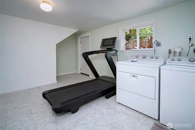 a bathroom with a sink a toilet and shower curtain