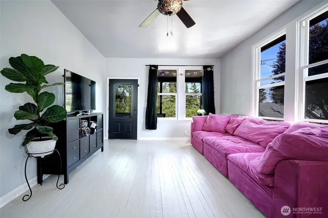 a living room with furniture and a window