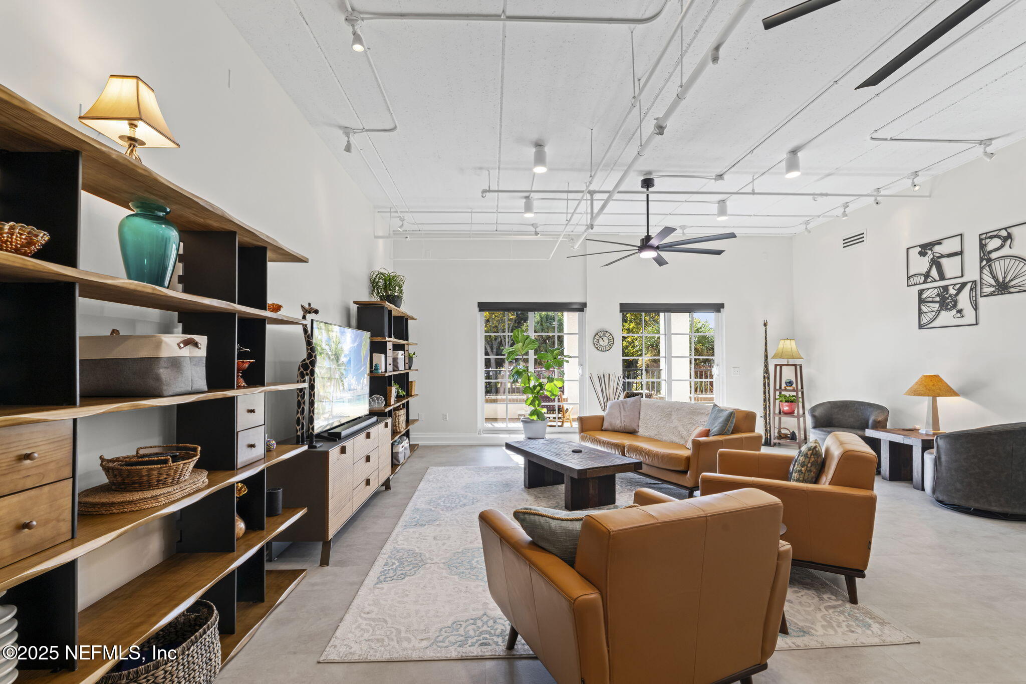 1661 Riverside Avenue, Unit 214 Jacksonville, FL 32204 - Photo 15 of 96 a living room with furniture a window and bookshelf