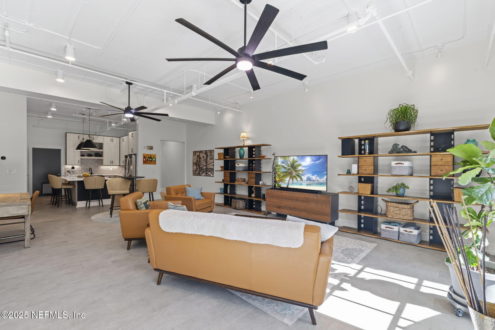 1661 Riverside Avenue, Unit 214 Jacksonville, FL 32204 - Photo 18 of 96 a living room with furniture and a flat screen tv