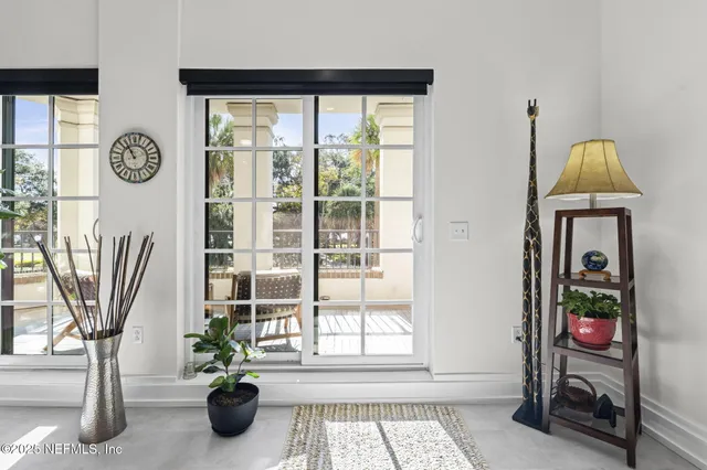 a bedroom with a bed next to a window with the outer view