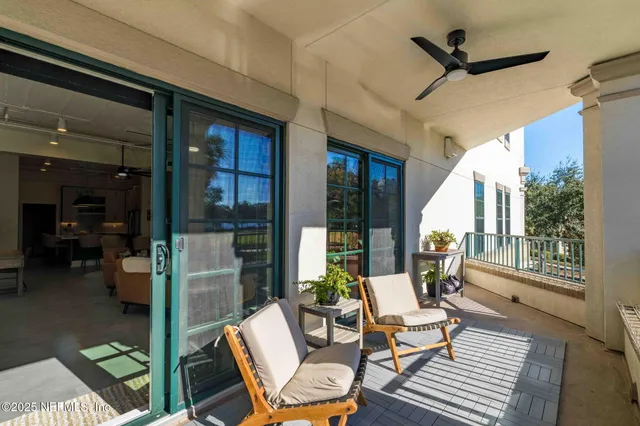 a bedroom with a bed couch and painting on the wall
