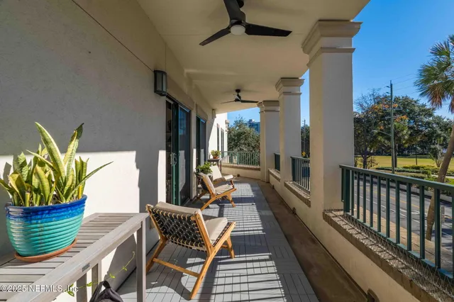 a view of a porch with furniture and front door