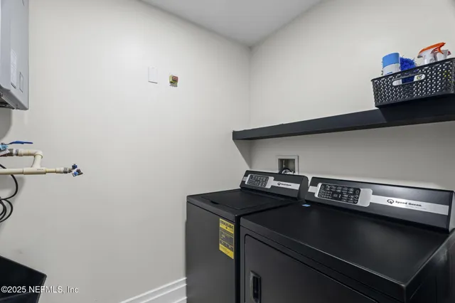 a view of a patio with a table and chairs