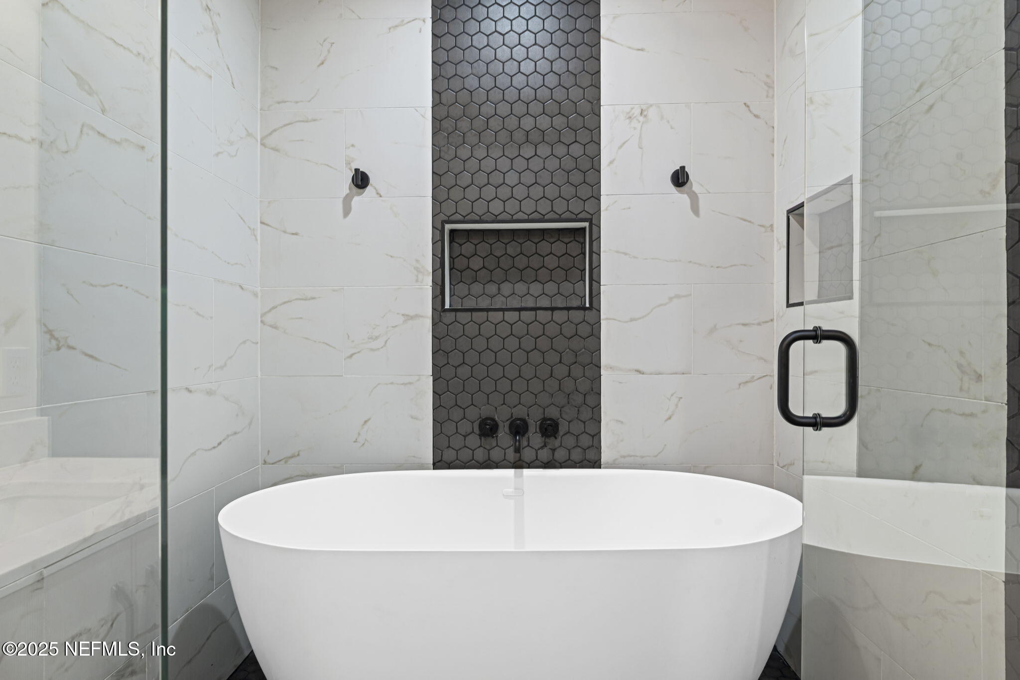 1661 Riverside Avenue, Unit 214 Jacksonville, FL 32204 - Photo 46 of 96 a white bath tub sitting in a bathroom