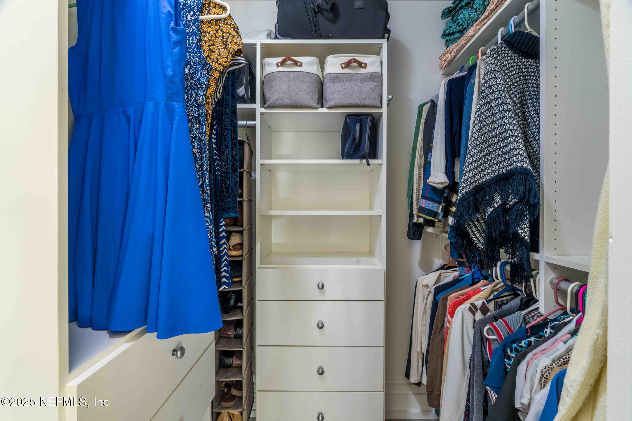 1661 Riverside Avenue, Unit 214 Jacksonville, FL 32204 - Photo 49 of 96 a view of walk in closet with clothes and shoes