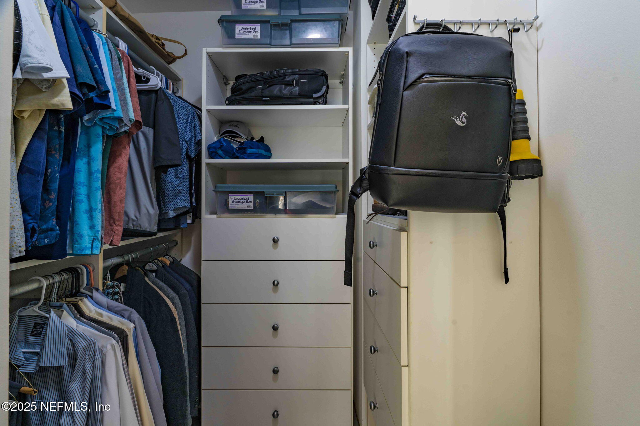 1661 Riverside Avenue, Unit 214 Jacksonville, FL 32204 - Photo 50 of 96 a view of walk in closet with clothes and shoes