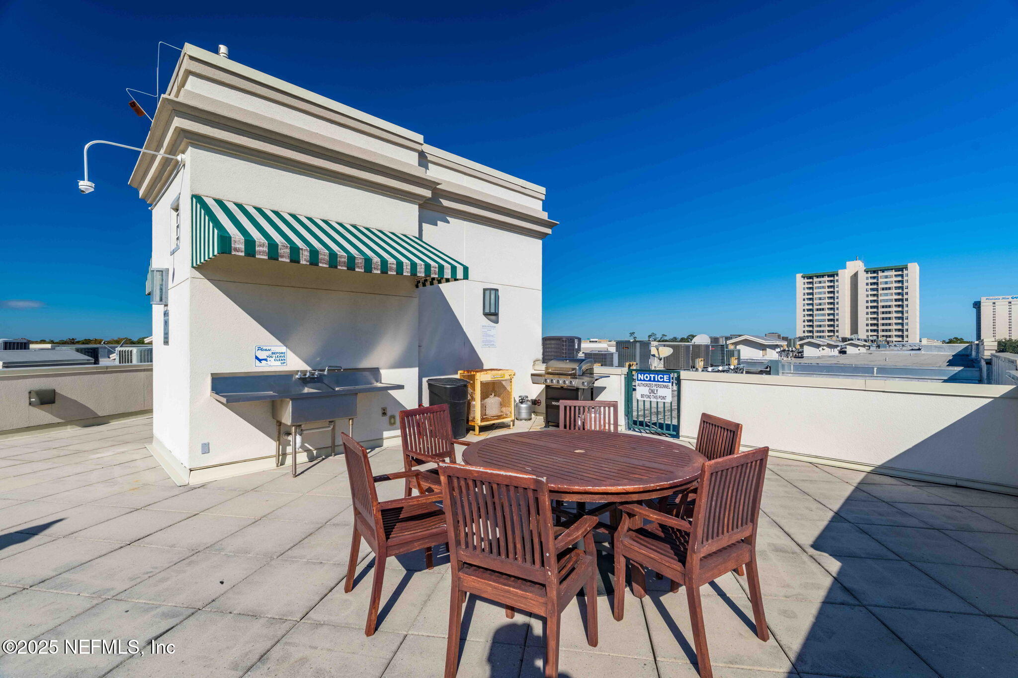 1661 Riverside Avenue, Unit 214 Jacksonville, FL 32204 - Photo 64 of 96 a view of a dinning table and chairs in the patio