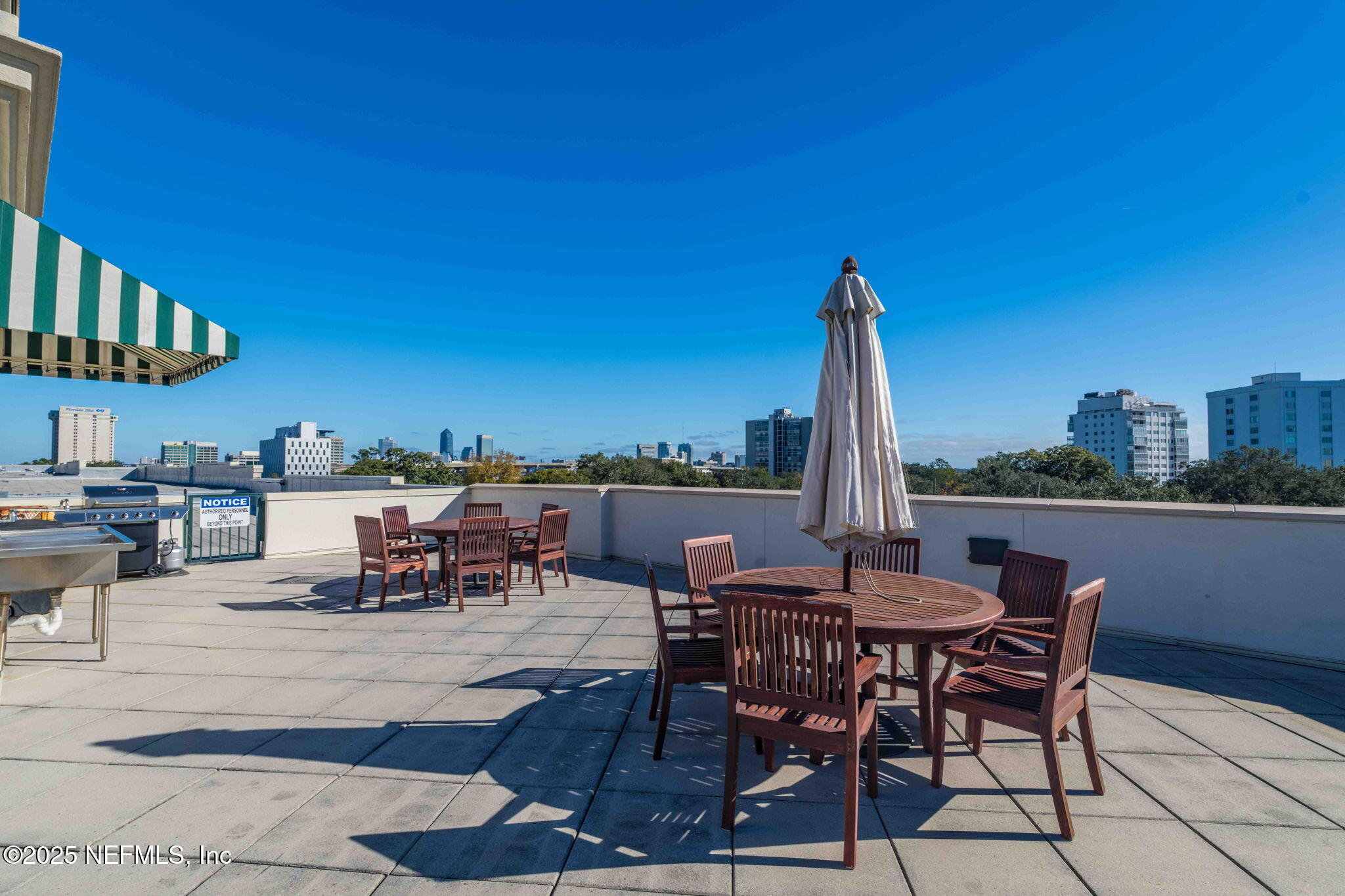 1661 Riverside Avenue, Unit 214 Jacksonville, FL 32204 - Photo 68 of 96 a view of a patio with a table and chairs