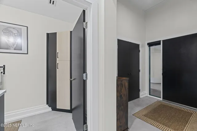 a living room with furniture a window and bookshelf