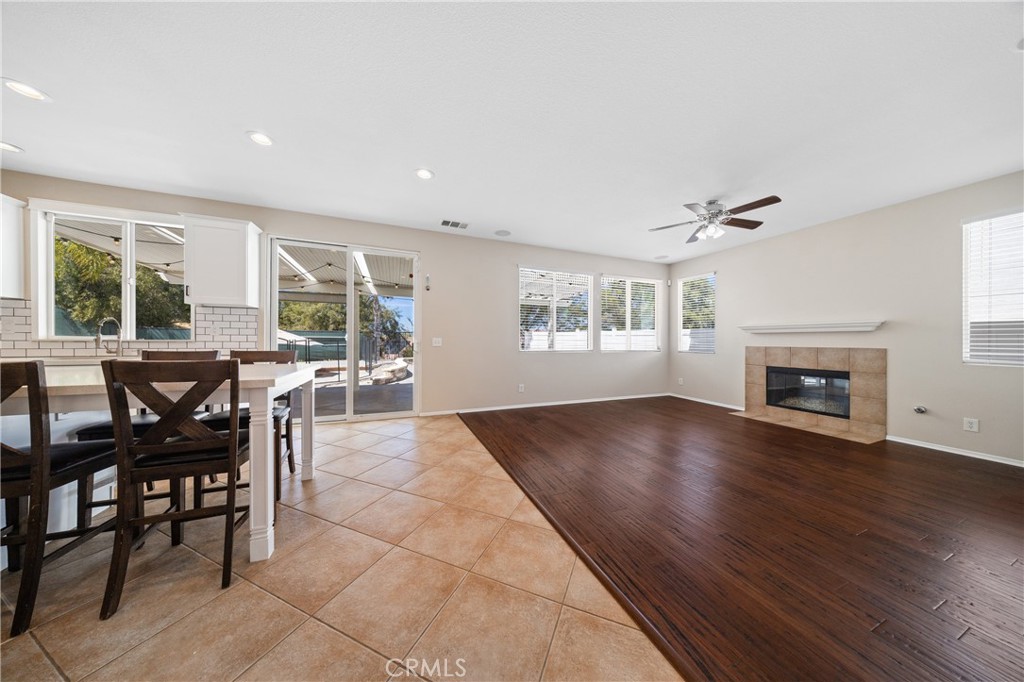 31207 Bell Mountain Road Menifee, CA 92584 - Photo 18 of 60 Open Concept Family Room With Fireplace And Backyard Views