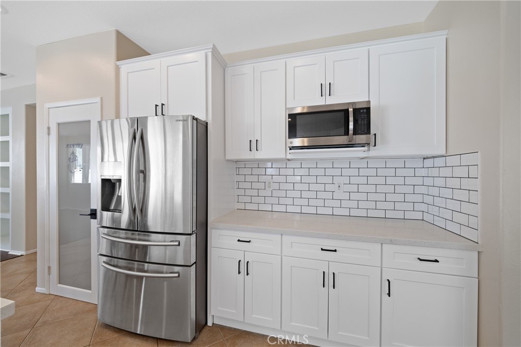 31207 Bell Mountain Road Menifee, CA 92584 - Photo 20 of 60 Modern Kitchen Featuring Tile Backsplash And Upgraded Cabinetry