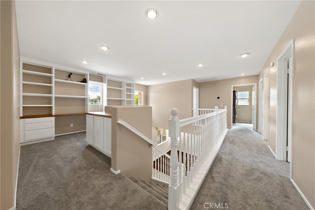 31207 Bell Mountain Road Menifee, CA 92584 - Photo 28 of 60 Upstairs Hallway With Built-In Storage And Open Railing