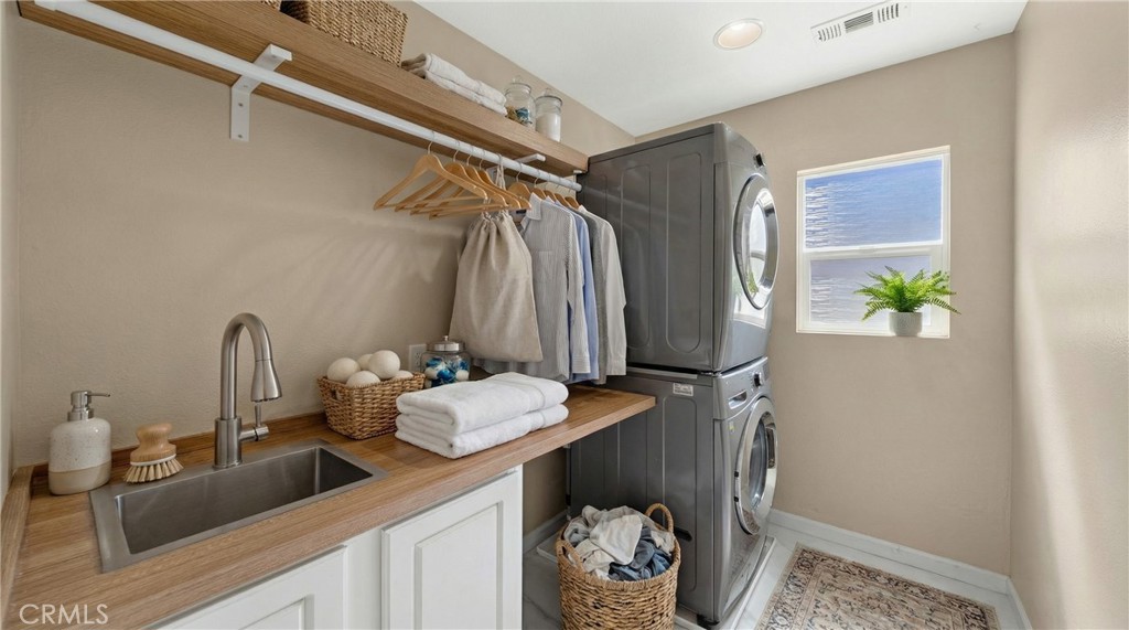 31207 Bell Mountain Road Menifee, CA 92584 - Photo 45 of 60 Laundry Room With Utility Sink And Storage Cabinets - Digitally Staged