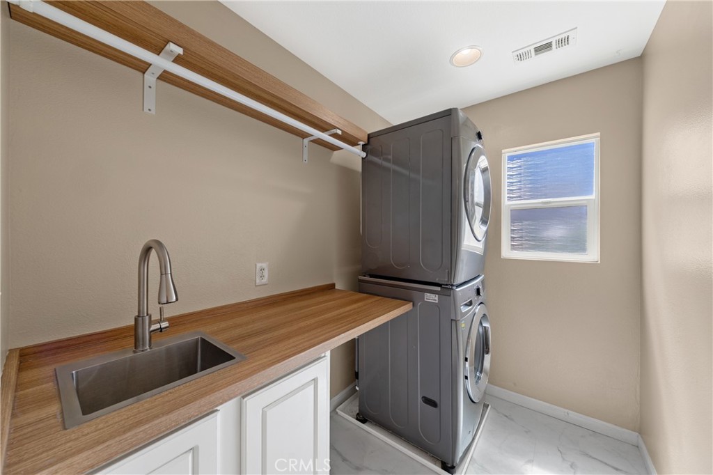 31207 Bell Mountain Road Menifee, CA 92584 - Photo 46 of 60 Laundry Room With Utility Sink And Storage Cabinets