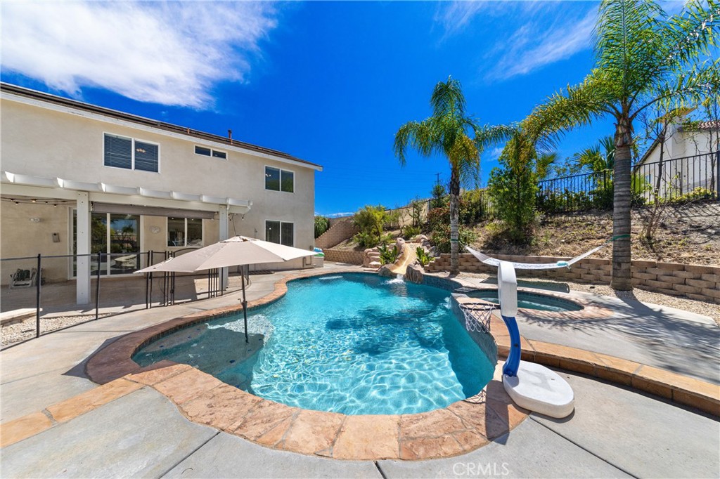 31207 Bell Mountain Road Menifee, CA 92584 - Photo 51 of 60 Pool Area With Slide And Entertaining Space