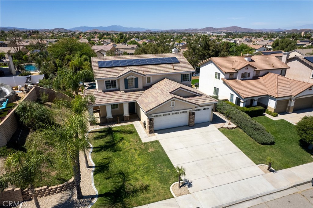 31207 Bell Mountain Road Menifee, CA 92584 - Photo 55 of 60 Aerial Front View Of Home With Spacious Driveway And Solar Panels