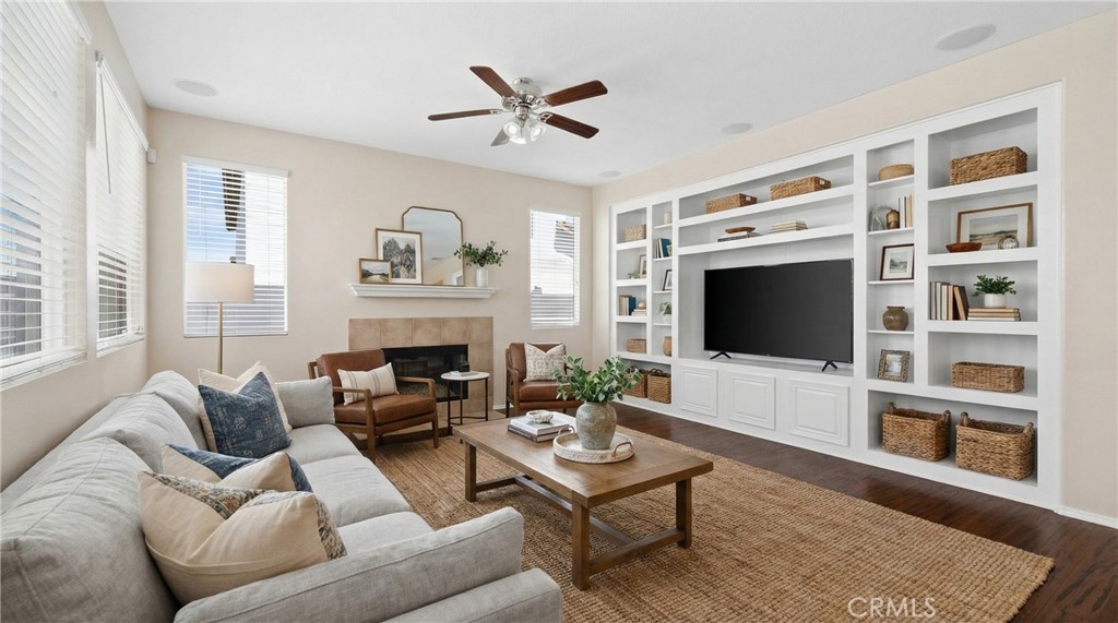 31207 Bell Mountain Road Menifee, CA 92584 - Photo 8 of 60 Spacious Family Room Featuring Built-In Shelving And Fireplace - Digitally Staged
