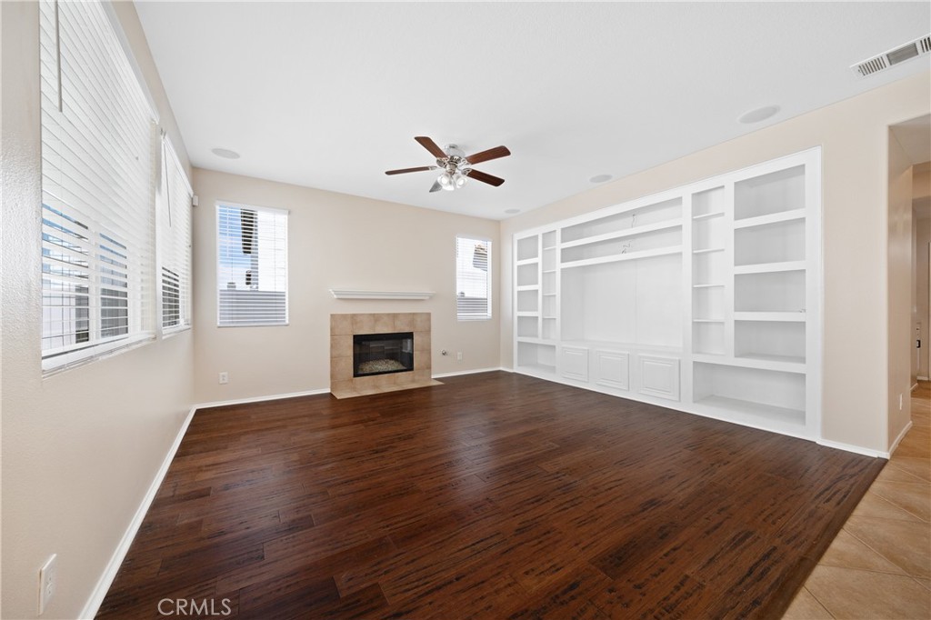 31207 Bell Mountain Road Menifee, CA 92584 - Photo 9 of 60 Spacious Family Room Featuring Built-In Shelving And Fireplace