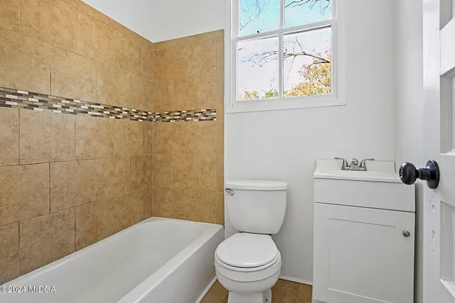 a toilet sitting next to a bathroom sink