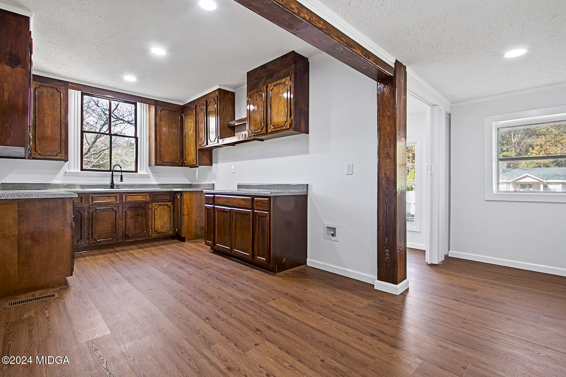 236 Old Clinton Road Gray, GA 31032 - Photo 19 of 27 a kitchen with stainless steel appliances granite countertop a stove and a wooden floors