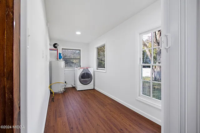 a view of workspace with wooden floor