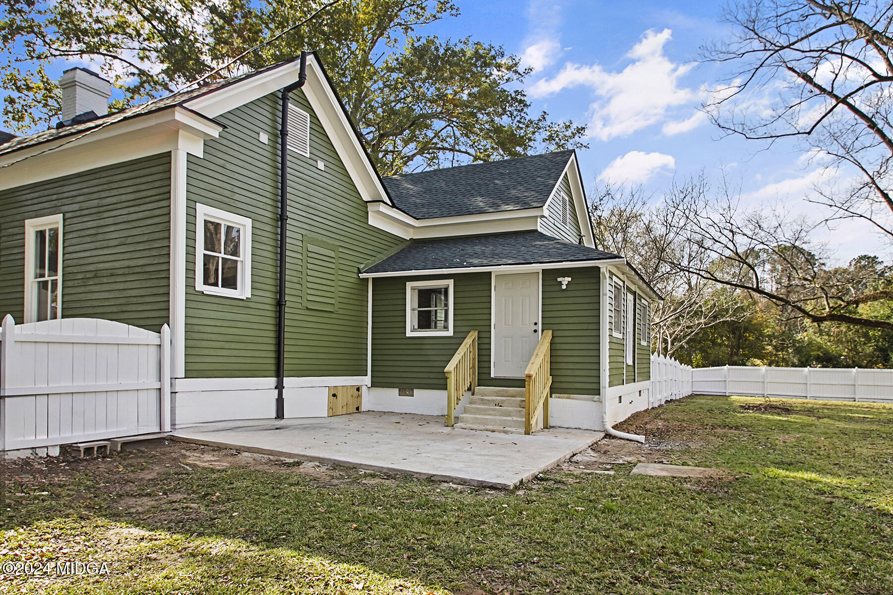 236 Old Clinton Road Gray, GA 31032 - Photo 22 of 27 a view of a house with backyard and a tree