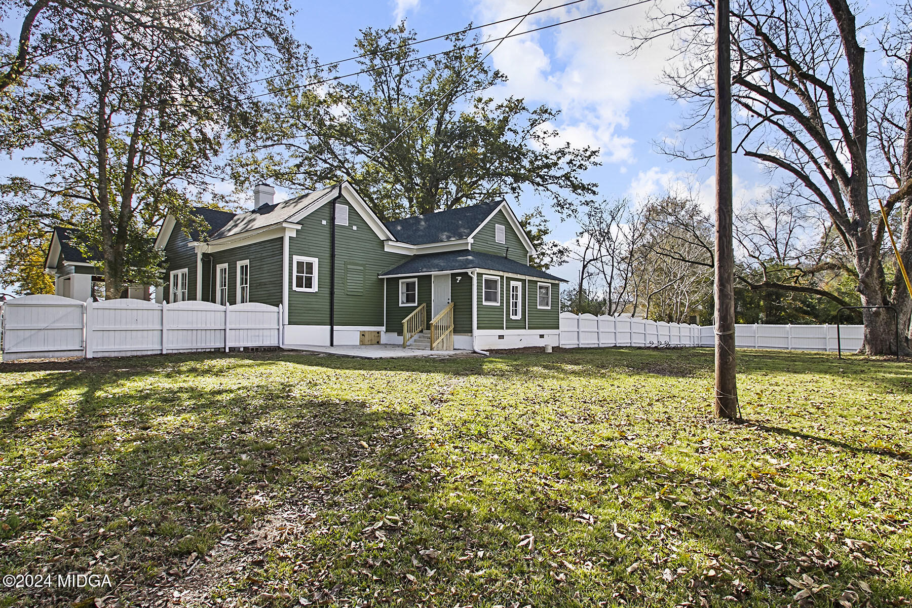 236 Old Clinton Road Gray, GA 31032 - Photo 23 of 27 a house with trees in the background