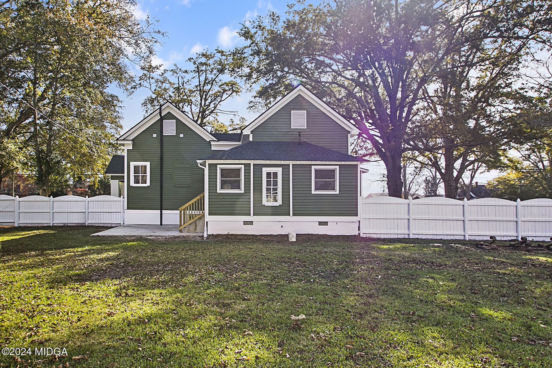 236 Old Clinton Road Gray, GA 31032 - Photo 24 of 27 a house that has a big yard and large trees