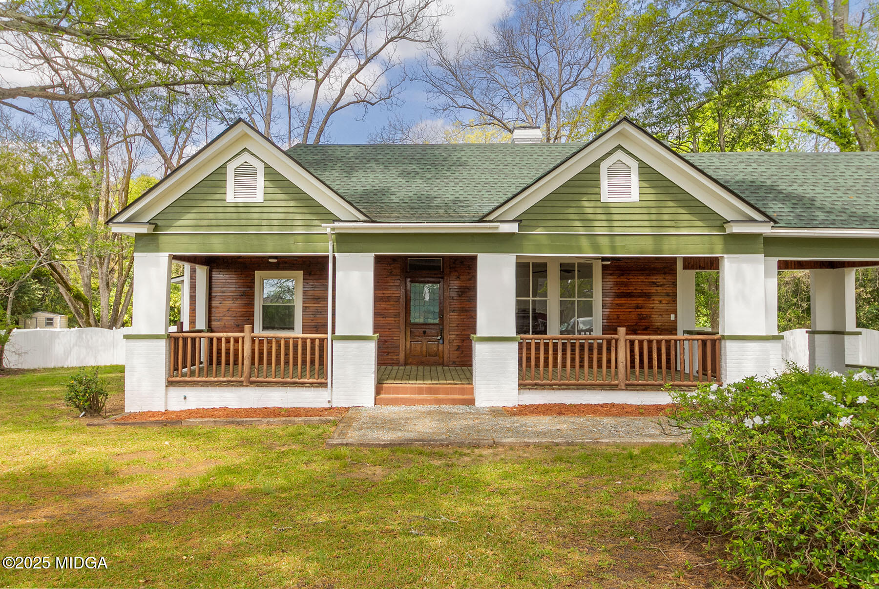 236 Old Clinton Road Gray, GA 31032 - Photo 3 of 27 a front view of a house with a garden