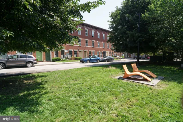 a view of a house with a yard porch and sitting area
