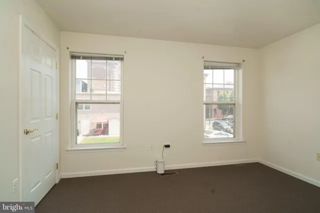 an empty room with windows