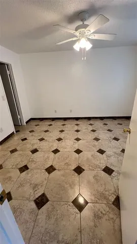 a view of a refrigerator in a kitchen