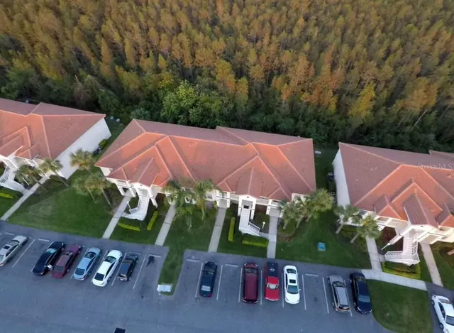 an aerial view of a house with yard swimming pool and outdoor seating